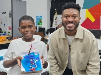  Boys and Girls Club student after working on an architecture activity